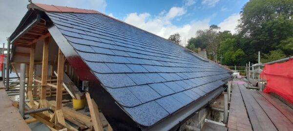 Newly constructed slated roof by PF & Co Construction Ltd in Cornwall, built using an innovative method where the roof was completed before the front elevation was removed.